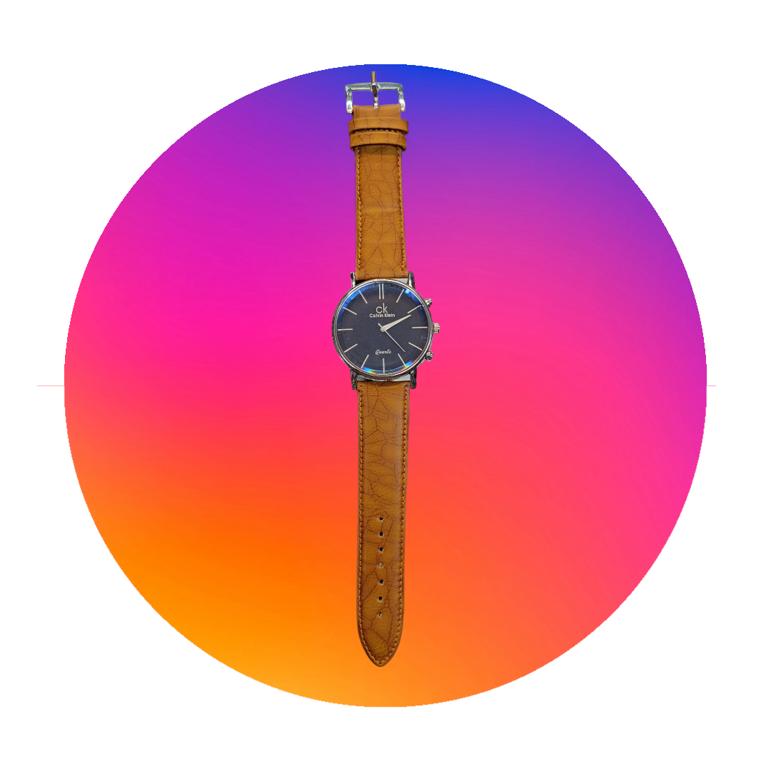 "Nautical Elegance: Navy Blue Round Dial CK Watch with Tan Leather Strap"Description: Set sail for sophistication with this CK watch, featuring a navy blue round dial paired with a stylish tan leather strap. Inspired by nautical themes, this tim