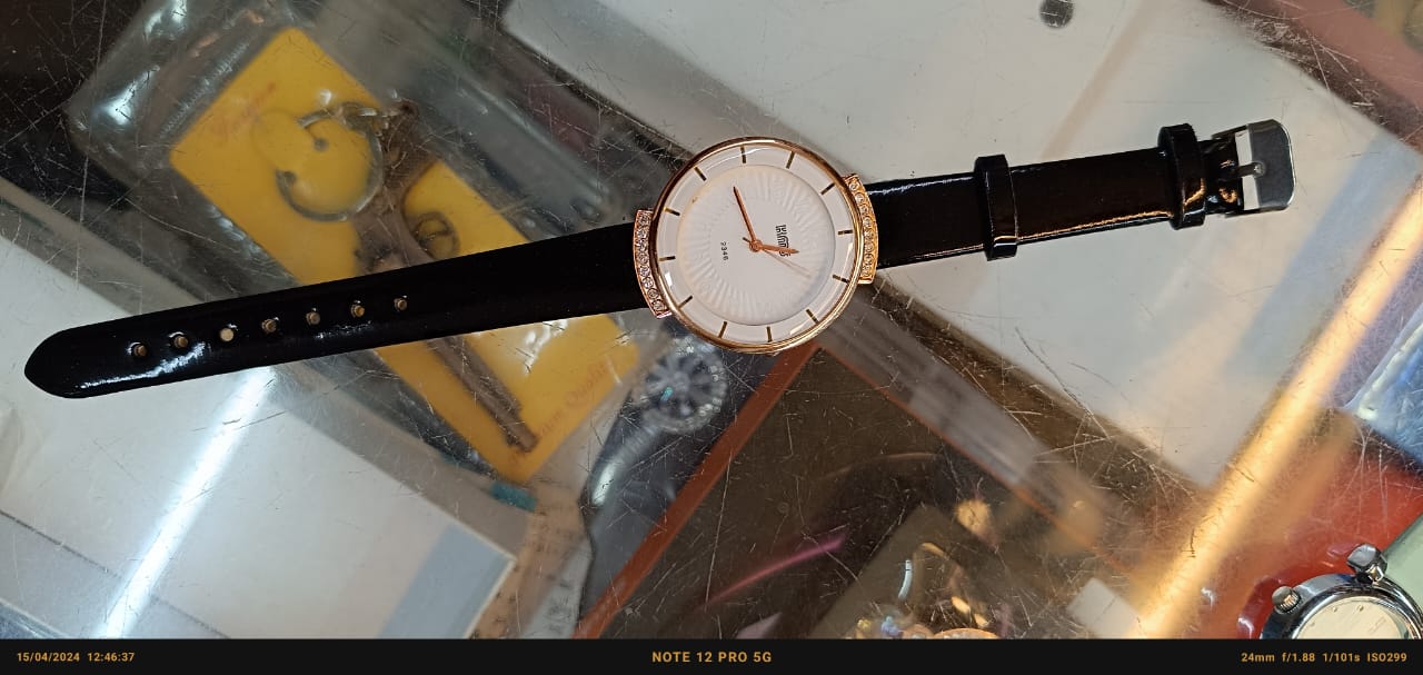 "Sleek Sophistication: Quartz Black Strap Ladies Watch with White and Gold Round Dial"